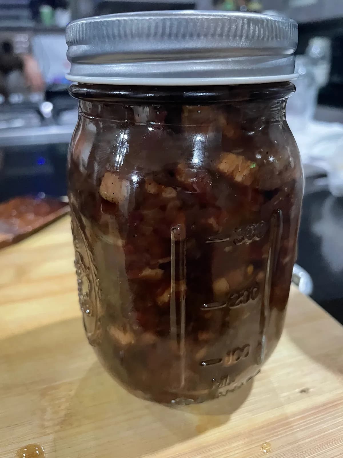 Jar of homemade bacon jam made from smoked bacon trimmings, onions, brown sugar and Jack Daniel’s at De Klomp Homestead